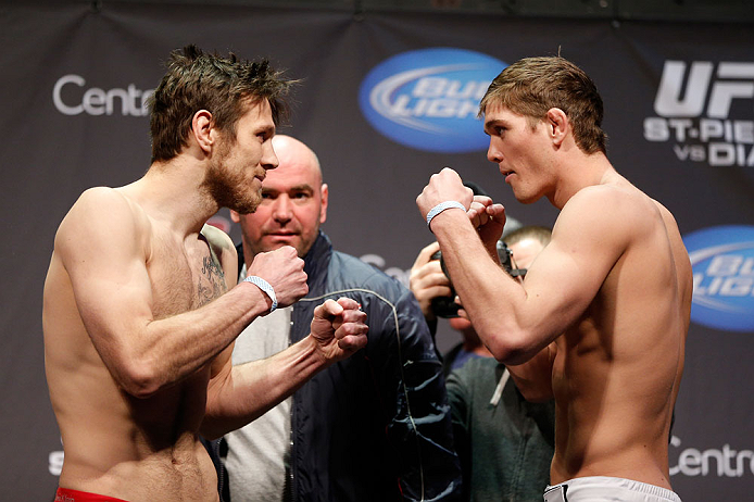 MONTREAL, QC - MARCH 15:  (L-R) Dan Miller and Jordan Mein face off during the UFC 158 weigh-in at Bell Centre on March 15, 2013 in Montreal, Quebec, Canada.  (Photo by Josh Hedges/Zuffa LLC/Zuffa LLC via Getty Images)