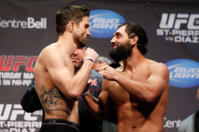 MONTREAL, QC - MARCH 15: Carlos Condit and Johny Hendricks face off during the UFC 158 weigh-in at Bell Centre on March 15, 2013 in Montreal, Quebec, Canada. (Photo by Josh Hedges/Zuffa LLC/Zuffa LLC via Getty Images)