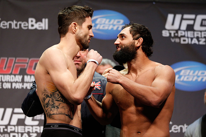 MONTREAL, QC - MARCH 15: Carlos Condit and Johny Hendricks face off during the UFC 158 weigh-in at Bell Centre on March 15, 2013 in Montreal, Quebec, Canada.  (Photo by Josh Hedges/Zuffa LLC/Zuffa LLC via Getty Images)