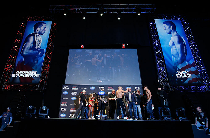 MONTREAL, QC - MARCH 15: (L-R) Opponents Georges St-Pierre and Nick Diaz face off during the UFC 158 weigh-in at Bell Centre on March 15, 2013 in Montreal, Quebec, Canada. (Photo by Josh Hedges/Zuffa LLC/Zuffa LLC via Getty Images)