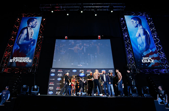 MONTREAL, QC - MARCH 15:  (L-R) Opponents Georges St-Pierre and Nick Diaz face off during the UFC 158 weigh-in at Bell Centre on March 15, 2013 in Montreal, Quebec, Canada.  (Photo by Josh Hedges/Zuffa LLC/Zuffa LLC via Getty Images)