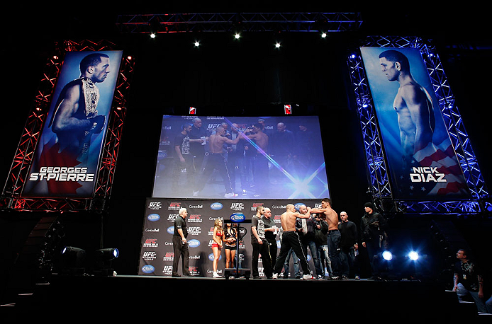 MONTREAL, QC - MARCH 15:  (L-R) Opponents Georges St-Pierre and Nick Diaz face off during the UFC 158 weigh-in at Bell Centre on March 15, 2013 in Montreal, Quebec, Canada.  (Photo by Josh Hedges/Zuffa LLC/Zuffa LLC via Getty Images)