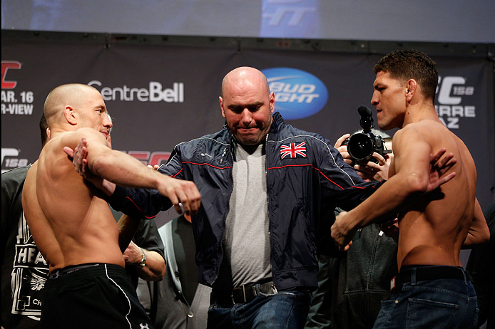 MONTREAL, QC - MARCH 15: Dana White pulls Georges St-Pierre (L) and Nick Diaz (R) apart during the UFC 158 weigh-in at Bell Centre on March 15, 2013 in Montreal, Quebec, Canada. (Photo by Josh Hedges/Zuffa LLC/Zuffa LLC via Getty Images)