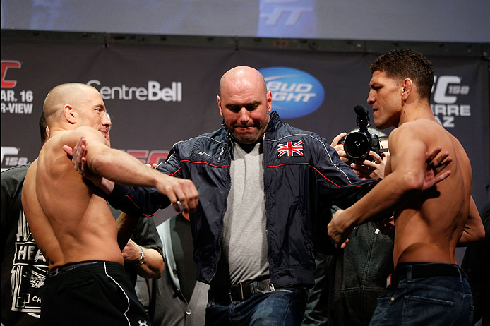 MONTREAL, QC - MARCH 15: Dana White pulls Georges St-Pierre (L) and Nick Diaz (R) apart during the UFC 158 weigh-in at Bell Centre on March 15, 2013 in Montreal, Quebec, Canada.  (Photo by Josh Hedges/Zuffa LLC/Zuffa LLC via Getty Images)