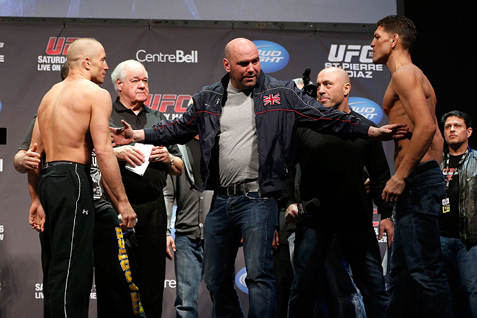 MONTREAL, QC - MARCH 15: Dana White pulls Georges St-Pierre (L) and Nick Diaz (R) apart during the UFC 158 weigh-in at Bell Centre on March 15, 2013 in Montreal, Quebec, Canada. (Photo by Josh Hedges/Zuffa LLC/Zuffa LLC via Getty Images)