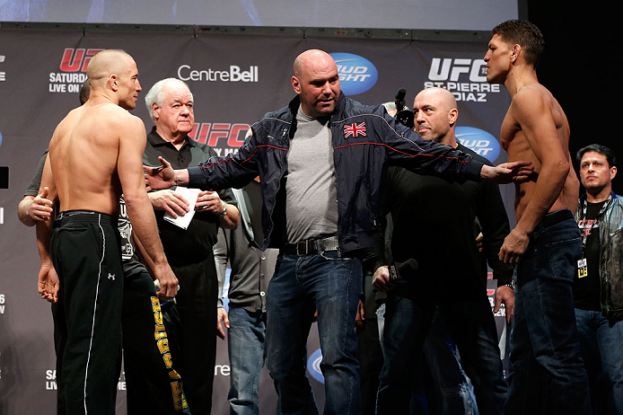 MONTREAL, QC - MARCH 15: Dana White pulls Georges St-Pierre (L) and Nick Diaz (R) apart during the UFC 158 weigh-in at Bell Centre on March 15, 2013 in Montreal, Quebec, Canada.  (Photo by Josh Hedges/Zuffa LLC/Zuffa LLC via Getty Images)