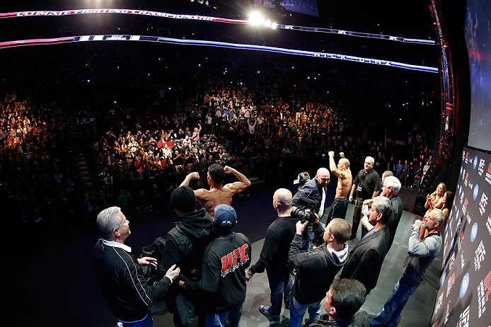 MONTREAL, QC - MARCH 15:  (R-L) Opponents Georges St-Pierre and Nick Diaz pose for the fans during the UFC 158 weigh-in at Bell Centre on March 15, 2013 in Montreal, Quebec, Canada.  (Photo by Josh Hedges/Zuffa LLC/Zuffa LLC via Getty Images)