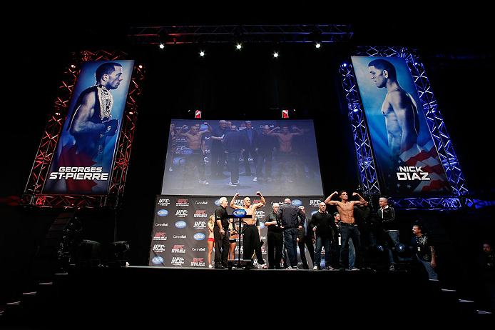 MONTREAL, QC - MARCH 15: (L-R) Opponents Georges St-Pierre and Nick Diaz pose for the fans during the UFC 158 weigh-in at Bell Centre on March 15, 2013 in Montreal, Quebec, Canada. (Photo by Josh Hedges/Zuffa LLC/Zuffa LLC via Getty Images)