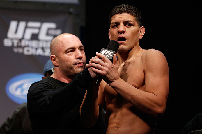 MONTREAL, QC - MARCH 15:  Nick Diaz speaks with Joe Rogan during the UFC 158 weigh-in at Bell Centre on March 15, 2013 in Montreal, Quebec, Canada.  (Photo by Josh Hedges/Zuffa LLC/Zuffa LLC via Getty Images)