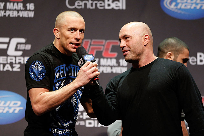 MONTREAL, QC - MARCH 15:  Georges St-Pierre speaks with Joe Rogan during the UFC 158 weigh-in at Bell Centre on March 15, 2013 in Montreal, Quebec, Canada.  (Photo by Josh Hedges/Zuffa LLC/Zuffa LLC via Getty Images)