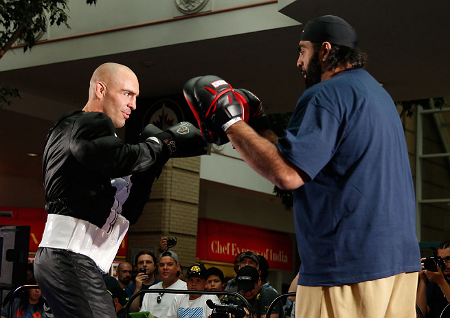 WINNIPEG, CANADA - JUNE 12: (L-R) Sean Pierson works out with former CFL football player Obby Khan during an open workout session for fans and media at Portage Place on June 12, 2013 in Winnipeg, Manitoba, Canada. (Photo by Josh Hedges/Zuffa LLC/Zuffa L