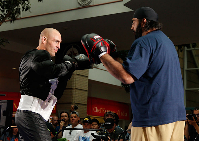 WINNIPEG, CANADA - JUNE 12:  (L-R) Sean Pierson works out with former CFL football player Obby Khan during an open workout session for fans and media at Portage Place on June 12, 2013 in Winnipeg, Manitoba, Canada.  (Photo by Josh Hedges/Zuffa LLC/Zuffa L