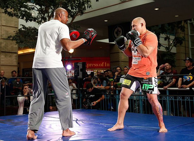 WINNIPEG, CANADA - JUNE 12: (R-L) Shawn Jordan works out with former CFL football player Lamar McGriggs during an open workout session for fans and media at Portage Place on June 12, 2013 in Winnipeg, Manitoba, Canada. (Photo by Josh Hedges/Zuffa LLC/Zu