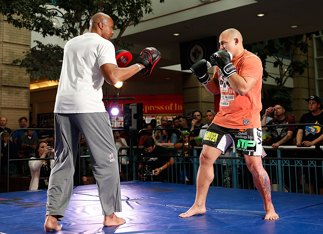 WINNIPEG, CANADA - JUNE 12:  (R-L) Shawn Jordan works out with former CFL football player Lamar McGriggs during an open workout session for fans and media at Portage Place on June 12, 2013 in Winnipeg, Manitoba, Canada.  (Photo by Josh Hedges/Zuffa LLC/Zu