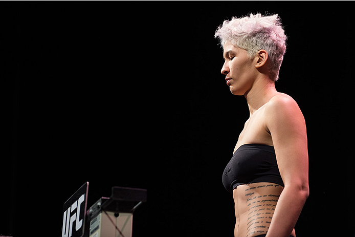 DALLAS, TX - MARCH 13: Larissa Pacheco stands on the scale during the UFC 185 weigh-ins at the Kay Bailey Hutchison Convention Center on March 13, 2015 in Dallas, Texas. (Photo by Cooper Neill/Zuffa LLC/Zuffa LLC via Getty Images)