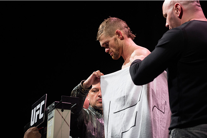 DALLAS, TX - MARCH 13: Daron Cruickshank stands on the scale during the UFC 185 weigh-ins at the Kay Bailey Hutchison Convention Center on March 13, 2015 in Dallas, Texas. (Photo by Cooper Neill/Zuffa LLC/Zuffa LLC via Getty Images)