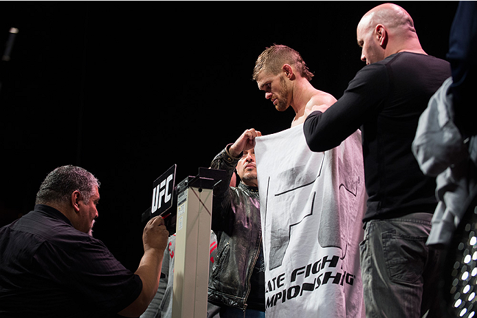 DALLAS, TX - MARCH 13: Daron Cruickshank stands on the scale during the UFC 185 weigh-ins at the Kay Bailey Hutchison Convention Center on March 13, 2015 in Dallas, Texas. (Photo by Cooper Neill/Zuffa LLC/Zuffa LLC via Getty Images)