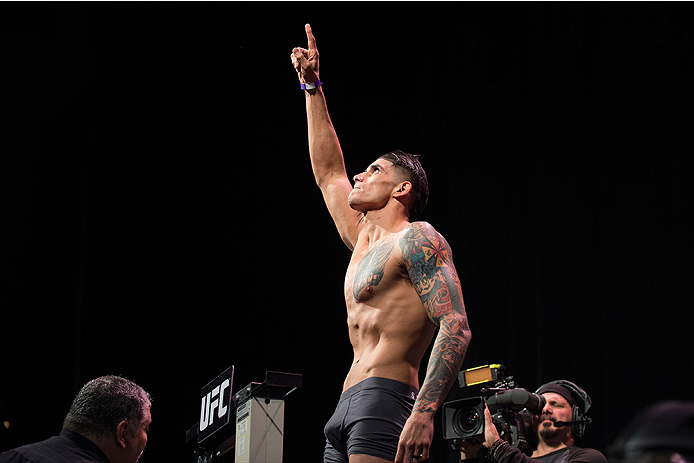 DALLAS, TX - MARCH 13: Roger Narvaez stands on the scale during the UFC 185 weigh-ins at the Kay Bailey Hutchison Convention Center on March 13, 2015 in Dallas, Texas. (Photo by Cooper Neill/Zuffa LLC/Zuffa LLC via Getty Images)