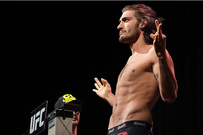 DALLAS, TX - MARCH 13: Elias Theodorou stands on the scale during the UFC 185 weigh-ins at the Kay Bailey Hutchison Convention Center on March 13, 2015 in Dallas, Texas. (Photo by Cooper Neill/Zuffa LLC/Zuffa LLC via Getty Images)