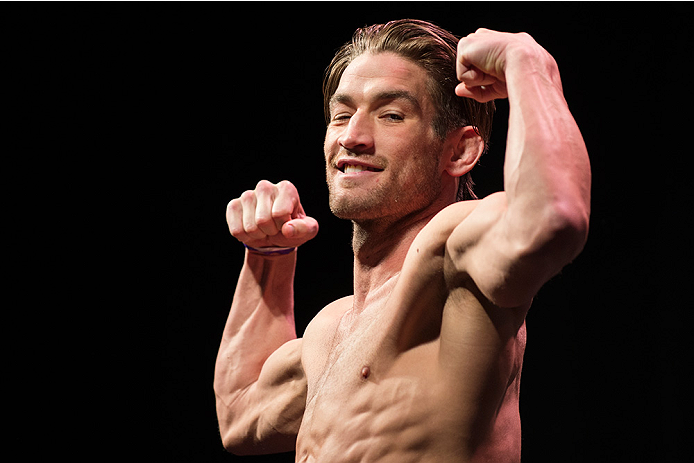 DALLAS, TX - MARCH 13: Sam Stout stands on the scale during the UFC 185 weigh-ins at the Kay Bailey Hutchison Convention Center on March 13, 2015 in Dallas, Texas. (Photo by Cooper Neill/Zuffa LLC/Zuffa LLC via Getty Images)