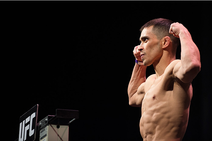 DALLAS, TX - MARCH 13: Chris Cariaso stands on the scale during the UFC 185 weigh-ins at the Kay Bailey Hutchison Convention Center on March 13, 2015 in Dallas, Texas. (Photo by Cooper Neill/Zuffa LLC/Zuffa LLC via Getty Images)