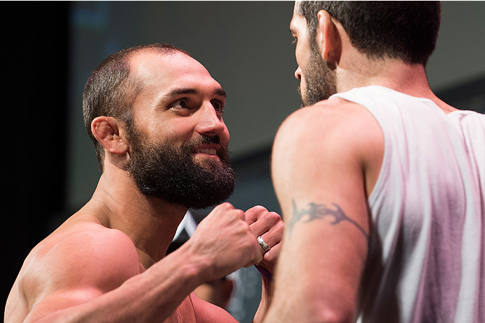 DALLAS, TX - MARCH 13: Johny Hendricks faces off with Matt Brown during the UFC 185 weigh-ins at the Kay Bailey Hutchison Convention Center on March 13, 2015 in Dallas, Texas. (Photo by Cooper Neill/Zuffa LLC/Zuffa LLC via Getty Images)