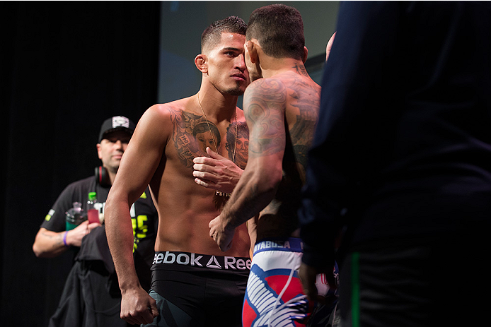 DALLAS, TX - MARCH 13: Anthony Pettis faces off with Rafael Dos Anjos during the UFC 185 weigh-ins at the Kay Bailey Hutchison Convention Center on March 13, 2015 in Dallas, Texas. (Photo by Cooper Neill/Zuffa LLC/Zuffa LLC via Getty Images)