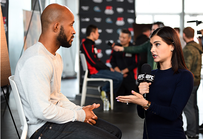 MONTREAL, QC - APRIL 23: UFC host Megan Olivi interacts with UFC Flyweight Champion Demetrious 'Mighty Mouse' Johnson during the UFC 186 Ultimate Media Day at Scena on April 23, 2015 in Montreal, Quebec, Canada. (Photo by Jeff Bottari/Zuffa LLC/Zuffa LLC