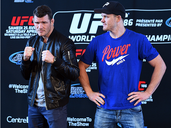 MONTREAL, QC - APRIL 23:  (L-R) Michael Bisping and CB Dollaway face off for the media during the UFC 186 Ultimate Media Day at Scena on April 23, 2015 in Montreal, Quebec, Canada. (Photo by Jeff Bottari/Zuffa LLC/Zuffa LLC via Getty Images)