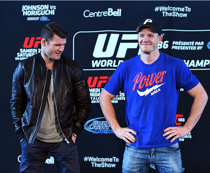 MONTREAL, QC - APRIL 23:  (L-R) Michael Bisping and CB Dollaway face off for the media during the UFC 186 Ultimate Media Day at Scena on April 23, 2015 in Montreal, Quebec, Canada. (Photo by Jeff Bottari/Zuffa LLC/Zuffa LLC via Getty Images)