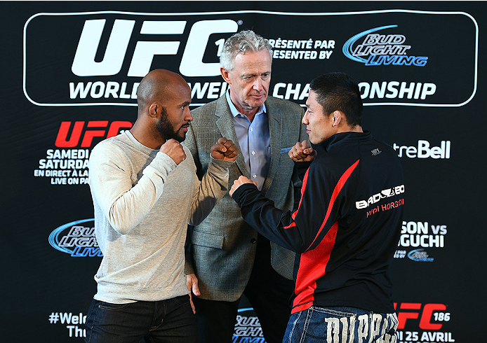 MONTREAL, QC - APRIL 23:  (L-R) UFC Flyweight Champion Demetrious 'Mighty Mouse' Johnson and Kyoji Horiguchi face off for the media during the UFC 186 Ultimate Media Day at Scena on April 23, 2015 in Montreal, Quebec, Canada. (Photo by Jeff Bottari/Zuffa 