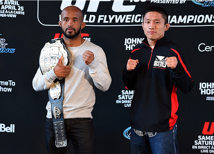 MONTREAL, QC - APRIL 23:  (L-R) UFC Flyweight Champion Demetrious 'Mighty Mouse' Johnson and Kyoji Horiguchi face off for the media during the UFC 186 Ultimate Media Day at Scena on April 23, 2015 in Montreal, Quebec, Canada. (Photo by Jeff Bottari/Zuffa 