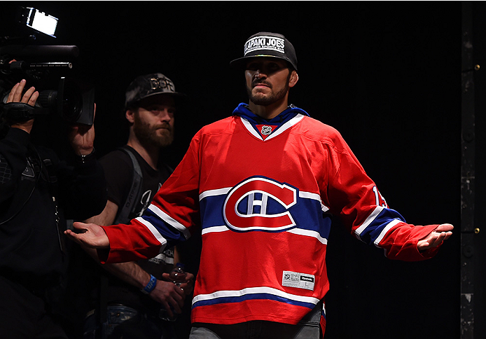 MONTREAL, QC - APRIL 24:   Patrick Cote of Canada prepares to step on the scale during the UFC 186 weigh-in at Metropolis on April 24, 2015 in Montreal, Quebec, Canada. (Photo by Josh Hedges/Zuffa LLC/Zuffa LLC via Getty Images)