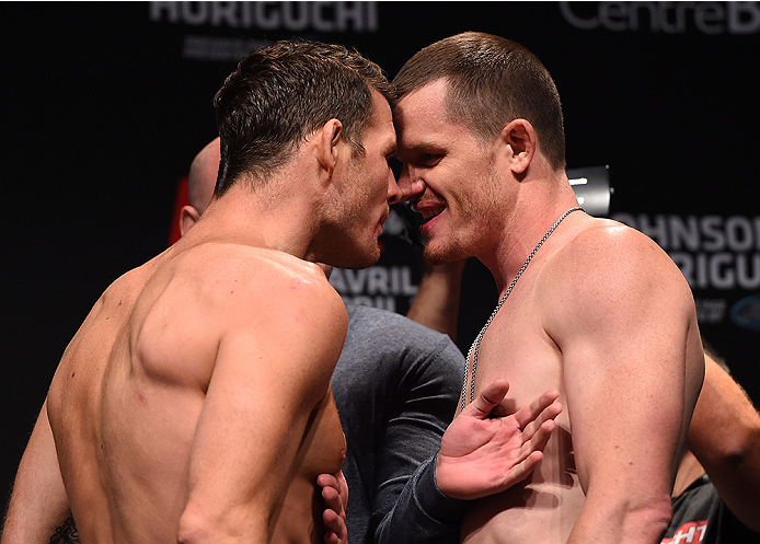 MONTREAL, QC - APRIL 24: (L-R) Opponents Michael Bisping of England and CB Dolloway of the United States face off during the UFC 186 weigh-in at Metropolis on April 24, 2015 in Montreal, Quebec, Canada. (Photo by Josh Hedges/Zuffa LLC/Zuffa LLC via Gett