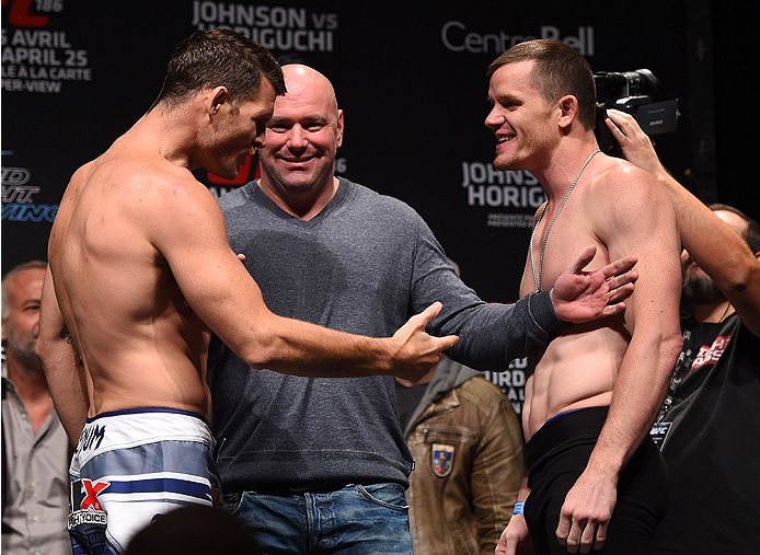 MONTREAL, QC - APRIL 24:   (L-R) Opponents Michael Bisping of England and CB Dolloway of the United States face off during the UFC 186 weigh-in at Metropolis on April 24, 2015 in Montreal, Quebec, Canada. (Photo by Josh Hedges/Zuffa LLC/Zuffa LLC via Gett