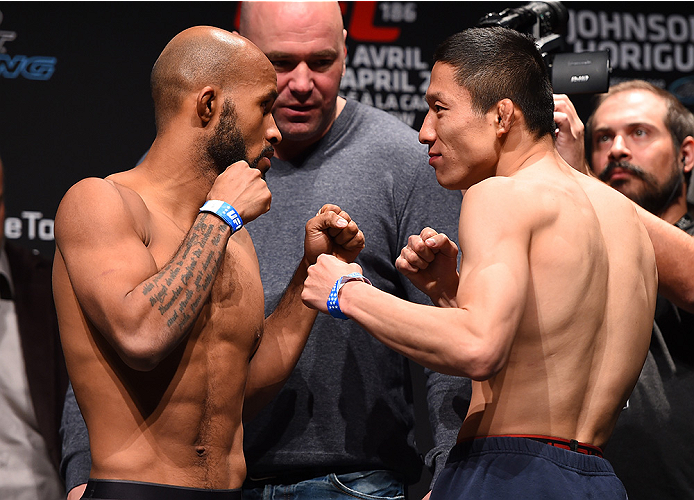 MONTREAL, QC - APRIL 24:   (L-R) Opponents Demetrious Johnson of the United States and Kyoji Horiguchi of Japan face off during the UFC 186 weigh-in at Metropolis on April 24, 2015 in Montreal, Quebec, Canada. (Photo by Josh Hedges/Zuffa LLC/Zuffa LLC via