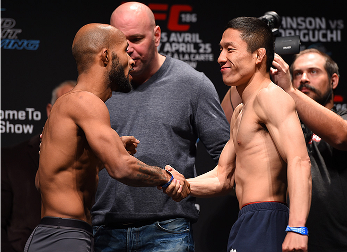 MONTREAL, QC - APRIL 24:   (L-R) Opponents Demetrious Johnson of the United States and Kyoji Horiguchi of Japan face off during the UFC 186 weigh-in at Metropolis on April 24, 2015 in Montreal, Quebec, Canada. (Photo by Josh Hedges/Zuffa LLC/Zuffa LLC via