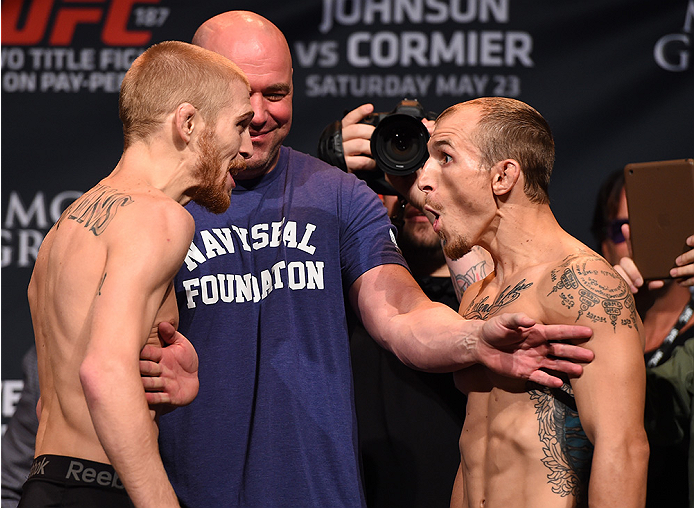 LAS VEGAS, NV - MAY 22:  (L-R) Opponents Justin Scoggins and Joshua Sampo face off during the UFC 187 weigh-in at the MGM Grand Conference Center on May 22, 2015 in Las Vegas, Nevada. (Photo by Josh Hedges/Zuffa LLC/Zuffa LLC via Getty Images)