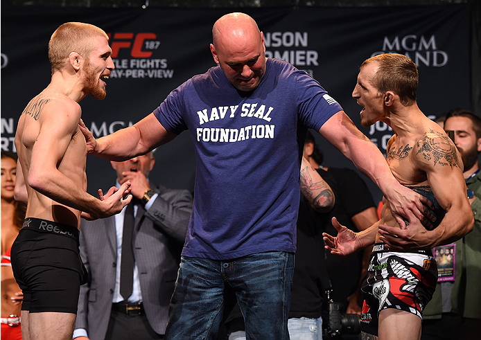 LAS VEGAS, NV - MAY 22:  (L-R) Opponents Justin Scoggins and Joshua Sampo face off during the UFC 187 weigh-in at the MGM Grand Conference Center on May 22, 2015 in Las Vegas, Nevada. (Photo by Josh Hedges/Zuffa LLC/Zuffa LLC via Getty Images)