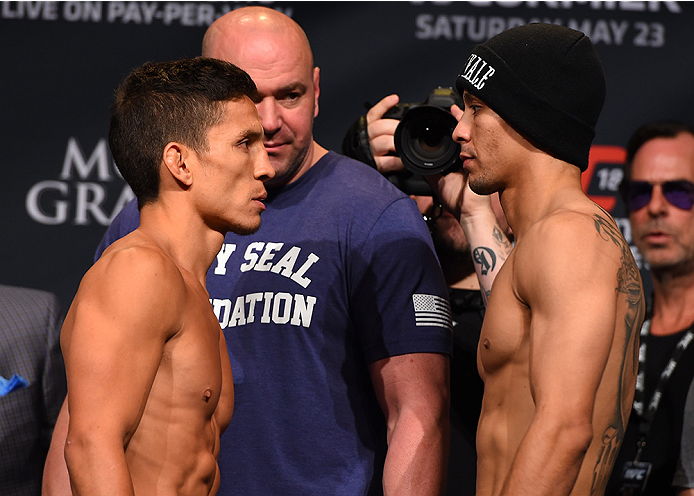 LAS VEGAS, NV - MAY 22:   (L-R) Opponents Joseph Benavidez and John Moraga face off during the UFC 187 weigh-in at the MGM Grand Conference Center on May 2, 2015 in Las Vegas, Nevada. (Photo by Josh Hedges/Zuffa LLC/Zuffa LLC via Getty Images)