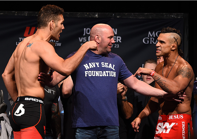 LAS VEGAS, NV - MAY 22:   (L-R) Chris Weidman and Vitor Belfort of Brazil face off during the UFC 187 weigh-in at the MGM Grand Conference Center on May 2, 2015 in Las Vegas, Nevada. (Photo by Josh Hedges/Zuffa LLC/Zuffa LLC via Getty Images)