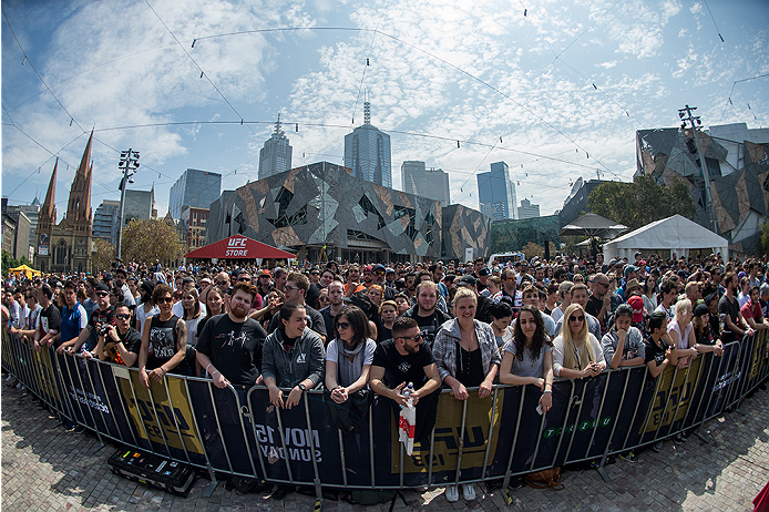 MELBOURNE, AUSTRALIA - NOVEMBER 12:  Fans watch as UFC women's bantamweight champion Ronda Rousey of the United States holds an open workout for fans and media at Federation Square on November 12, 2015 in Melbourne, Australia. (Photo by Brandon Magnus/Zuf