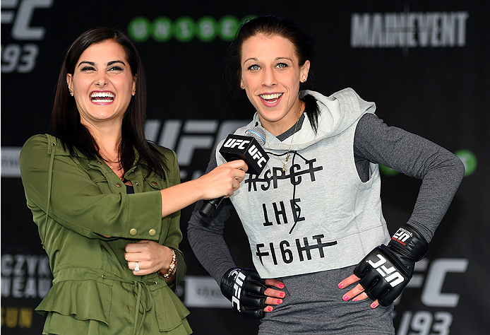 MELBOURNE, AUSTRALIA - NOVEMBER 12:  UFC women's strawweight champion Joanna Jedrzejczyk (R) of Poland is interviewed by Megan Olivi after an open workout for fans and media at Federation Square on November 12, 2015 in Melbourne, Australia. (Photo by Josh
