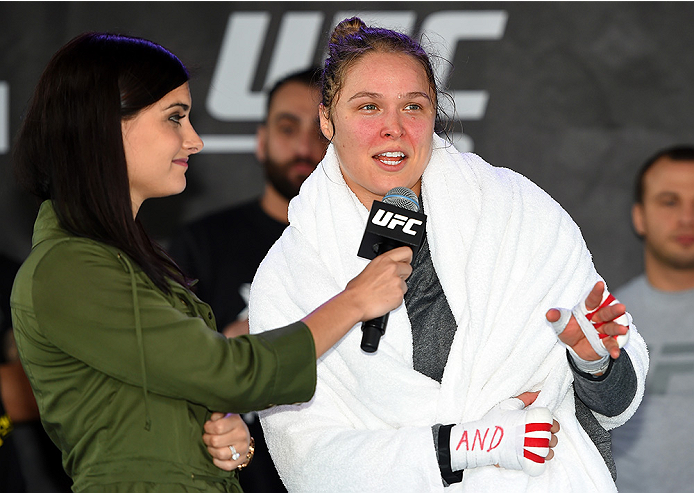 MELBOURNE, AUSTRALIA - NOVEMBER 12:  UFC women's bantamweight champion Ronda Rousey (R) of the United States is interviewed by Megan Olivi after an open workout for fans and media at Federation Square on November 12, 2015 in Melbourne, Australia. (Photo b