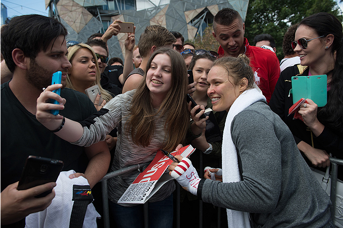 MELBOURNE, AUSTRALIA - NOVEMBER 12:  UFC women's bantamweight champion Ronda Rousey of the United States takes pictures with fans at Federation Square on November 12, 2015 in Melbourne, Australia. (Photo by Brandon Magnus/Zuffa LLC/Zuffa LLC via Getty Ima