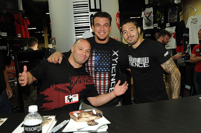 LAS VEGAS, NV - JULY 7: (L-R) Matt Serra, Frank Mir and Dan Hardy sign autographs during the UFC Fan Expo at the Mandalay Bay Convention Center on July 7, 2012 in Las Vegas, Nevada. (Photo by Al Powers/Zuffa LLC/Zuffa LLC via Getty Images) *** Local C
