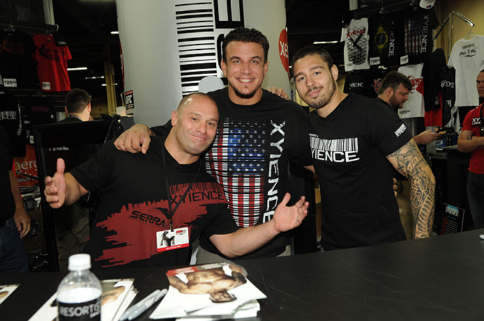 LAS VEGAS, NV - JULY 7:   (L-R) Matt Serra, Frank Mir and Dan Hardy sign autographs during the UFC Fan Expo at the Mandalay Bay Convention Center on July 7, 2012 in Las Vegas, Nevada.  (Photo by Al Powers/Zuffa LLC/Zuffa LLC via Getty Images)  *** Local C