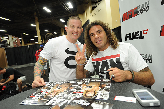 LAS VEGAS, NV - JULY 06: Clay Guida poses with a fan at the UFC Fan Expo on July 6, 2012 in Las Vegas, Nevada. (Photo by Al Powers /Zuffa LLC/Zuffa LLC via Getty Images)