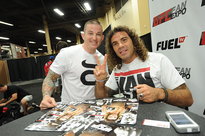 LAS VEGAS, NV - JULY 06:  Clay Guida poses with a fan at the UFC Fan Expo on July 6, 2012 in Las Vegas, Nevada. (Photo by Al Powers /Zuffa LLC/Zuffa LLC via Getty Images) 