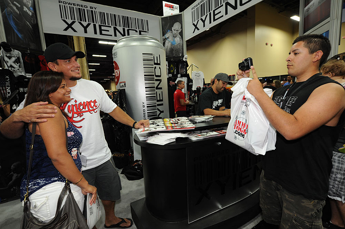 LAS VEGAS, NV - JULY 06:  Frank Mir poses with a fan at the UFC Fan Expo on July 6, 2012 in Las Vegas, Nevada. (Photo by Al Powers /Zuffa LLC/Zuffa LLC via Getty Images) 